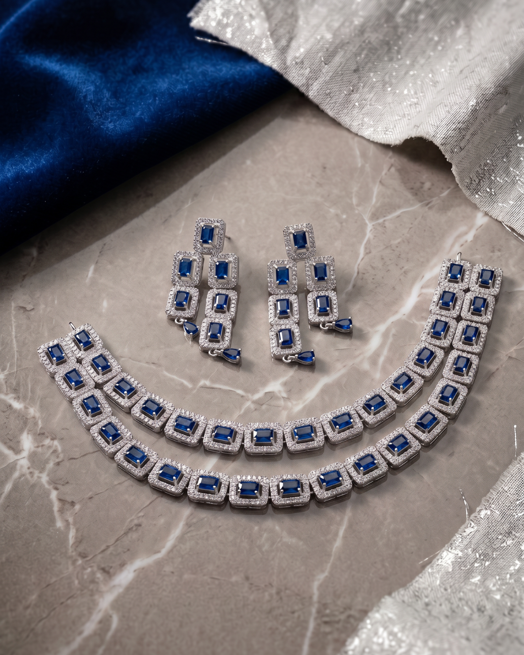 Jewellery flatlay styled on marble and velvet