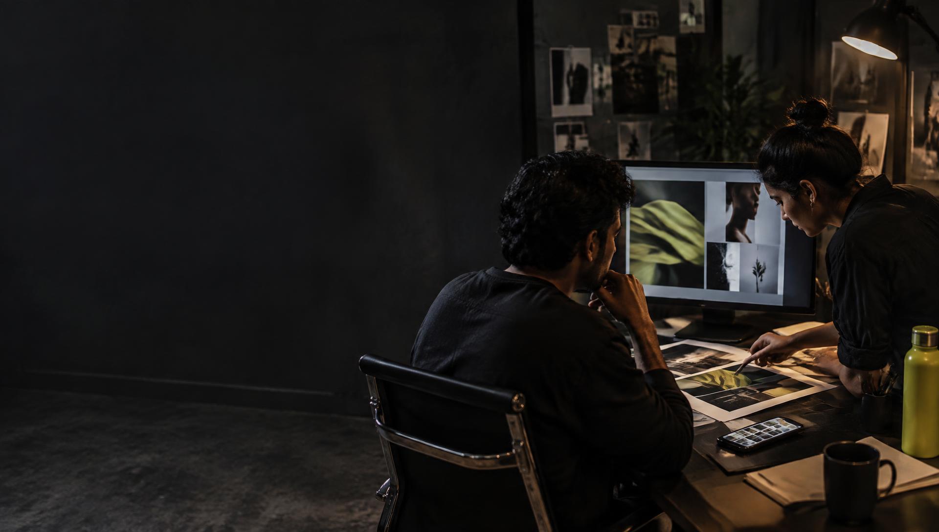 Agency team reviewing campaign imagery in a working studio
